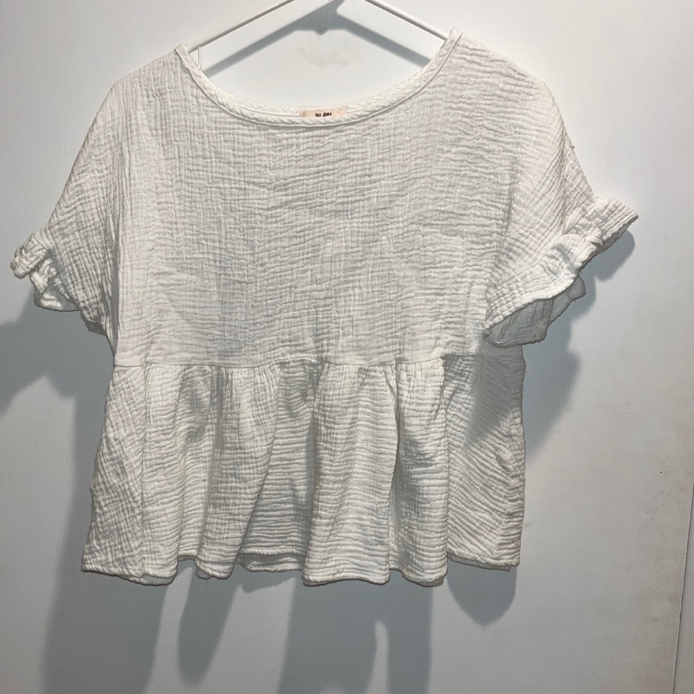 Francesca’s white ruffle top